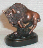 Figurine featuring a copper-colored running buffalo